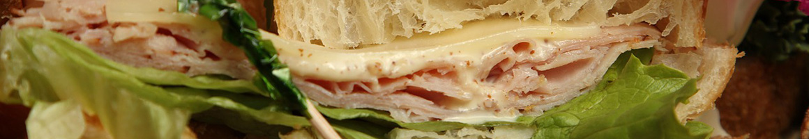 Eating Deli Sandwich at Cutting Board Deli restaurant in Fairfield, NJ.